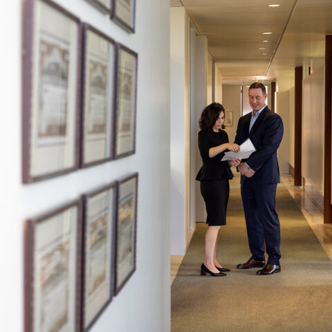 News Man Woman In Hall With Documents