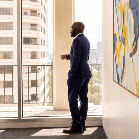 News Man With Coffee Near Window